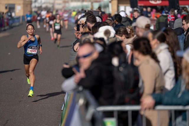 Robyn Lucas heads along the sea front at Hove Lawns in the approach to the finish line of The BM10K on Sunday 7th April 2024.Photo: Jed Leicester for London Marathon EventsFor further information: media@londonmarathonevents.co.uk:Images from the 2024 Brighton Marathon