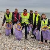 Jess Brown-Fuller with fellow councillors cleaning East Wittering Beach.