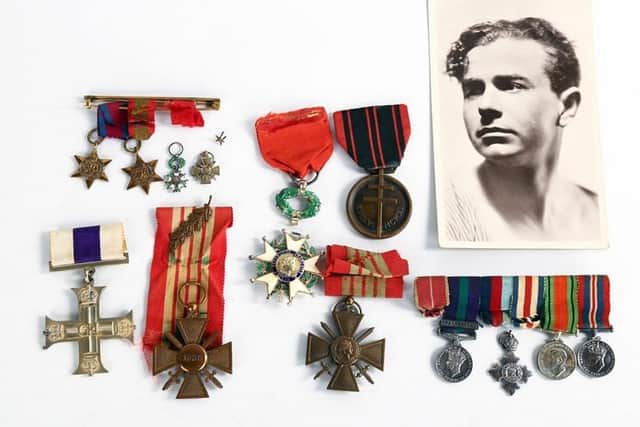 Denis Rake when he was younger. Pictured are Denis Rake's Military Cross, Croix de Guerre with Palm and Chevalier de la Legion d'Honneur, a French Resistance medal and miniatures. Photo from Burstow & Hewett