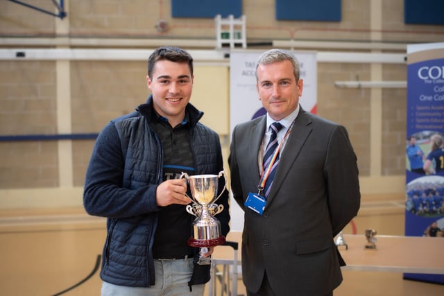 Eoin O'Donoghue collected the Mia Craen 'Outstanding Contribution to Sport' prize from Steve Martell (deputy principal)