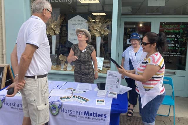 Horsham Matters team asking residents to sign the Guarantee our Essentials petition. 