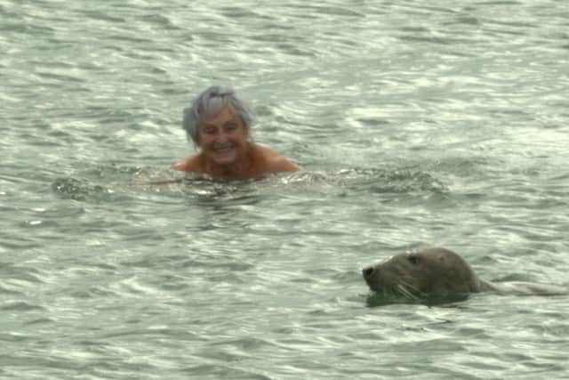 Sheer joy: Pam swims with the seal. 
Photo: Ged Burnett