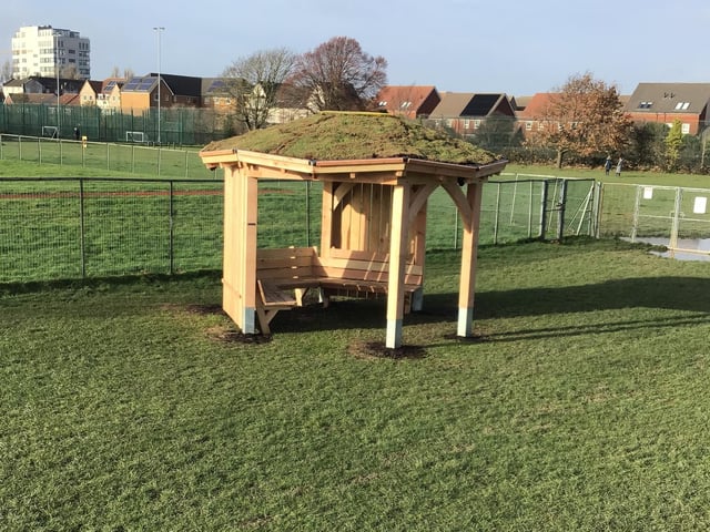 The hexagonal structure by Handspring Design features a living green roof with skylight, protective side windbreaks and seating for up to 10 people