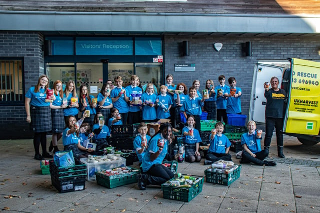 Students from The Regis School with some of the food donations