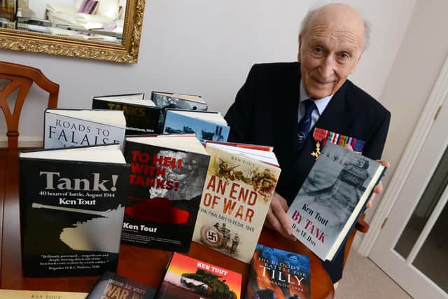 Dr Ken Tout with his books, including the much-praised Tank!