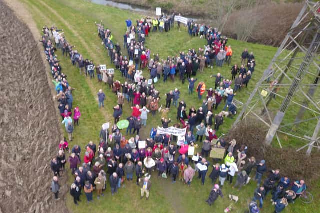 More than 300 people gathered to send a defiant message against developers planning to build on the green gap between Worthing and Ferring. Photo: Doug Larkam