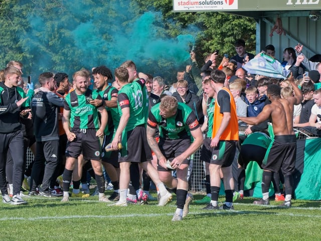 Burgess Hill Town players, fans and staff celebrate surviving in the Isthmian south east division at the end of their 0-0 draw with Beckenham