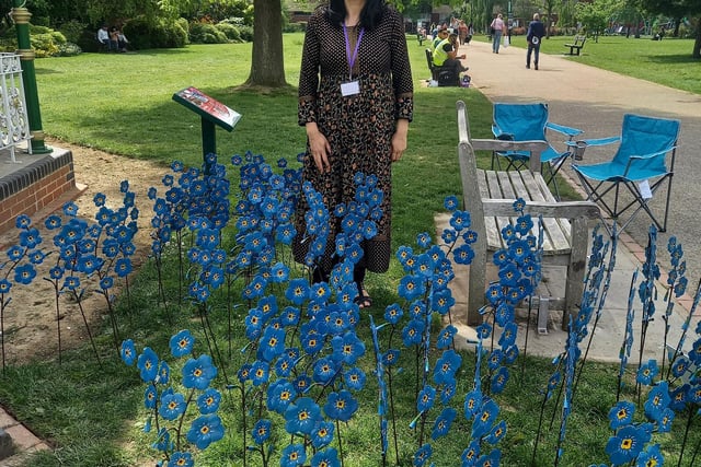 Parveen Khan next to the forget-me-knots