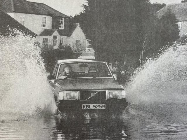 A car sails through the floods.