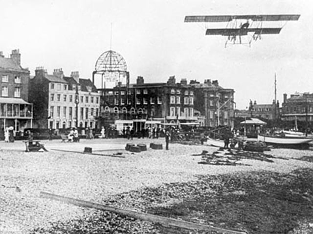 A biplane flying over Worthing when The Kursaal was being built by Carl Seebold in 1911