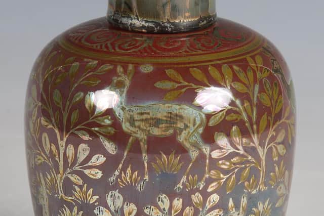 A Pilkington's Royal Lancastrian lustre pottery vase and cover, dated 1915, decorated by Richard Joyce.