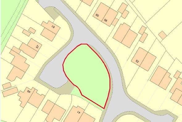 The patch of land in Collingwood Road, Horsham, that has been put up for sale by auction with a guide price of £10,000