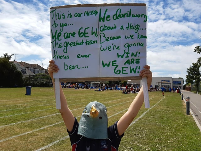 Joseph from 6EW with the banner he made showing his class chant