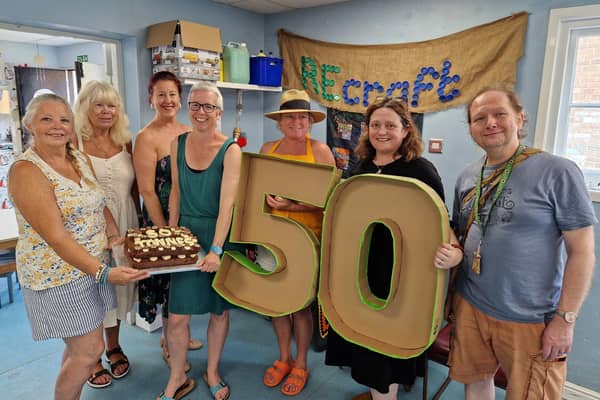 Over the Moon director Emily Phillips, centre, with The Scrap Space volunteers and members