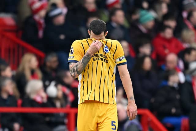 Lewis Dunk of Brighton & Hove Albion looks dejected after scoring an own goal at Nottingham Forest