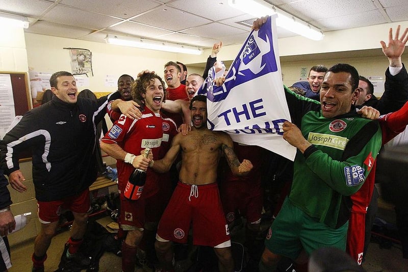 Goalscorer Sergio Torres (2nd L) celebrates victory with team mates after the FA Cup 3rd round win over Derby County at Broadfield Stadium on January 10, 2011.