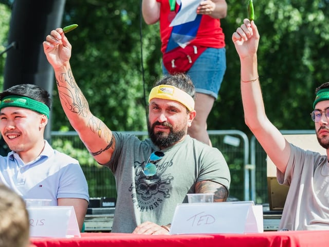 The competitors toast the crowd.