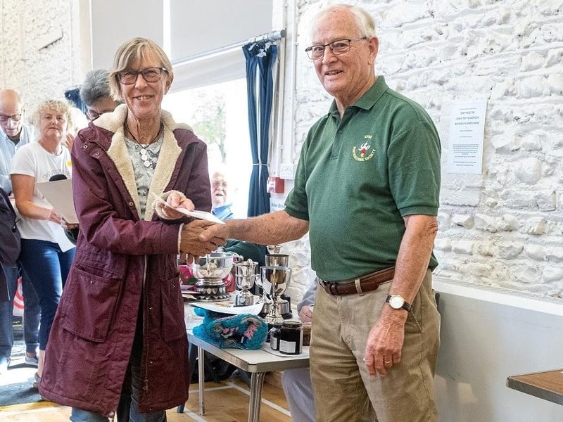 Christina Goodwyn is presented with the Worshipful Company of Gardeners Certificate for best fruit exhibit. She also shared the Hanson Challenge Cup for vegetables and fruit with Laurence Pilfold