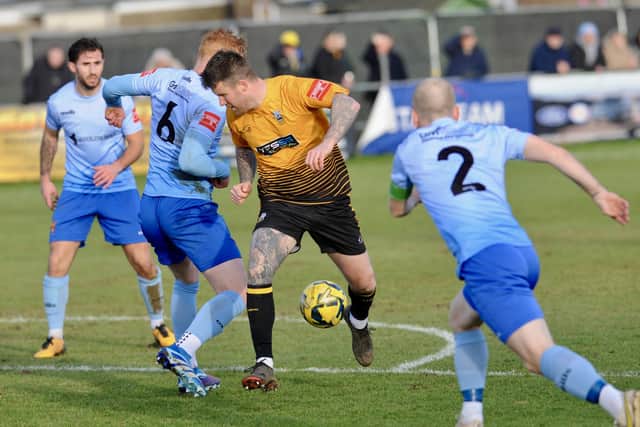 Littlehampton's George Gaskin in the thick of the battle against Lancing | Picture: Stephen Goodger