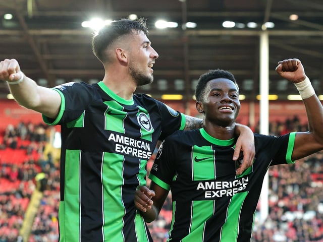 SHEFFIELD, ENGLAND - FEBRUARY 18: Simon Adingra celebrates scoring his team's fifth goal with Jakub Moder of Brighton & Hove Albion during the Premier League match between Sheffield United and Brighton & Hove Albion at Bramall Lane on February 18, 2024 in Sheffield, England. (Photo by David Rogers/Getty Images)