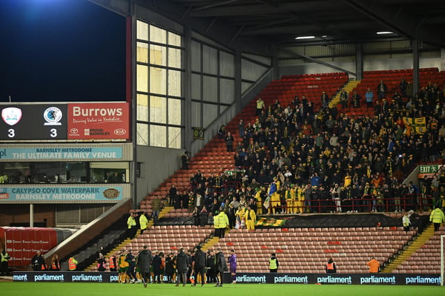 Horsham fans celebrating after the Emirates FA Cup First Round match between Barnsley and Horsham at Oakwell Stadium.