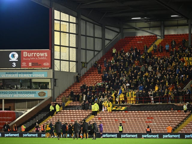 Horsham fans celebrating after the Emirates FA Cup First Round match between Barnsley and Horsham at Oakwell Stadium.