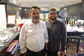 Darchini owner Syed Hossain with his son Fahim. Photo: Sussex World