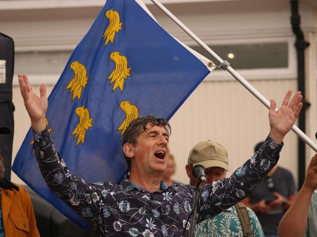 Chris Hare singing sea shanties with The Duck Pond Sailors on Worthing promenade