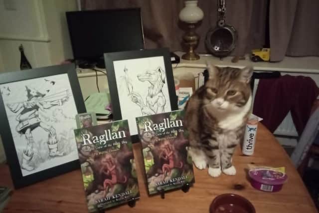Sarah's cat showing off her new novel