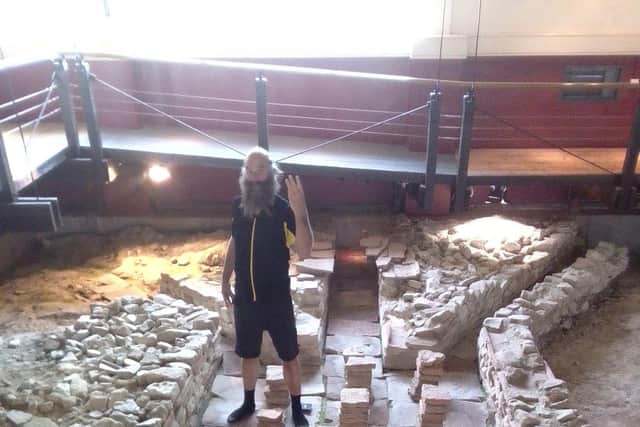 Dr Rob Symmons in the hypocaust at Fishbourne Roman Palace