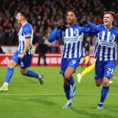 NOTTINGHAM, ENGLAND - NOVEMBER 25:  Joao Pedro of Brighton and Hove Albion celebrates with Evan Ferguson and Lewis Dunk during the Premier League match between Nottingham Forest and Brighton & Hove Albion at City Ground on November 25, 2023 in Nottingham, United Kingdom. (Photo by Marc Atkins/Getty Images)