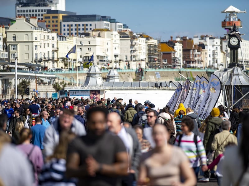 People enjoy the spring sunshine this Good Friday on Brighton seafront in East Sussex.