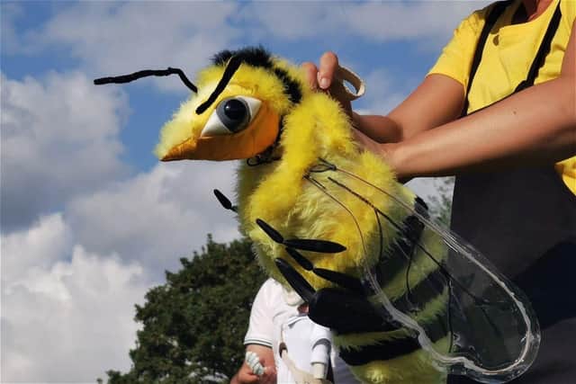See things from a bee's eye view with Applause's captivating and colourfull Buzz puppetry show