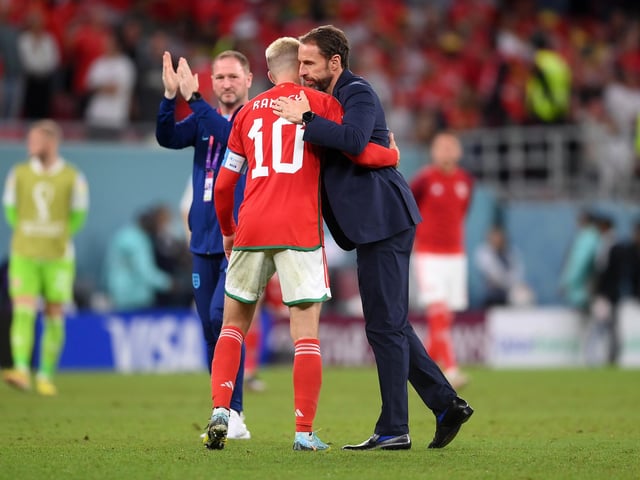 DOHA, QATAR - NOVEMBER 29: Aaron Ramsey of Wales is consoled by Gareth Southgate, Head Coach of England, after the FIFA World Cup Qatar 2022 Group B match between Wales and England at Ahmad Bin Ali Stadium on November 29, 2022 in Doha, Qatar. (Photo by Laurence Griffiths/Getty Images)