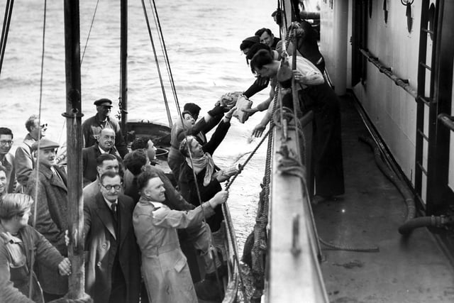 Delivering food for Christmas to the Sovereign Light Ship. Photo contributed by Eastbourne Local History Society.