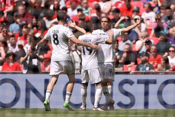 Danilo Orsi of Crawley Town celebrates scoring his team's first goal with teammates during the Sky Bet League Two Play-Off Final match between Crawley Town and Crewe Alexandra at Wembley Stadium on May 19, 2024 in London, England. (Photo by Paul Harding/Getty Images)