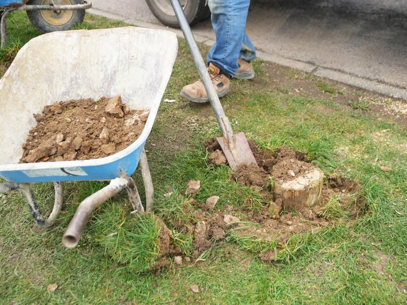 Council workers replace wooden bollards