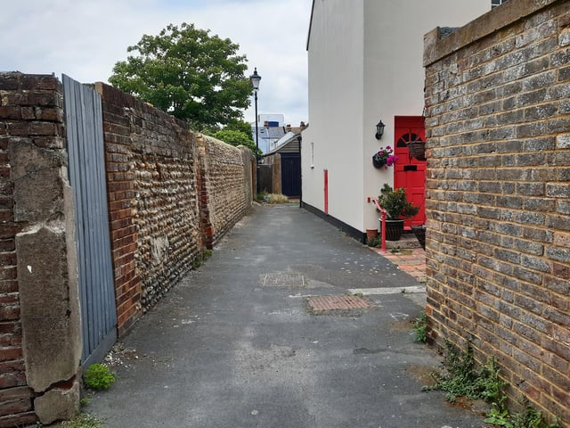 The first hint of colour as you approach Brunswick Cottages along the twitten that marks the historic boundary between Worthing and Heene