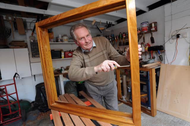 Tony Horn working on the window of the Waverley