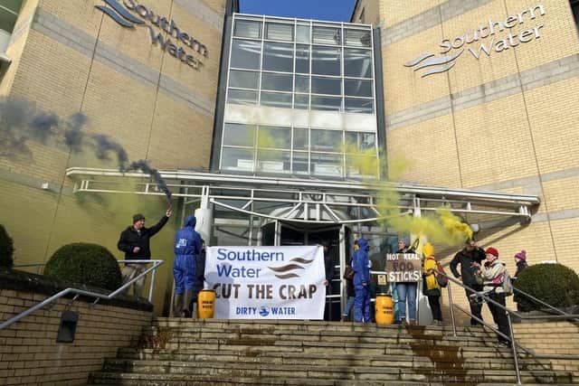 In the striking protest this morning (Monday, March 13), rebels unfurled banners and delivered a letter to Southern Water in Yeoman Road. Inside contained a list of demands including for the water company to ‘stop illegally pouring untreated sewage into waterways’. Photo: Extinction Rebellion