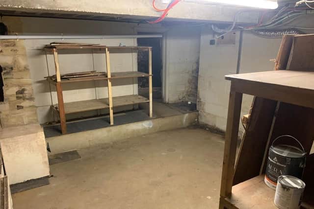 Part of the cellar space below Trojan Barber