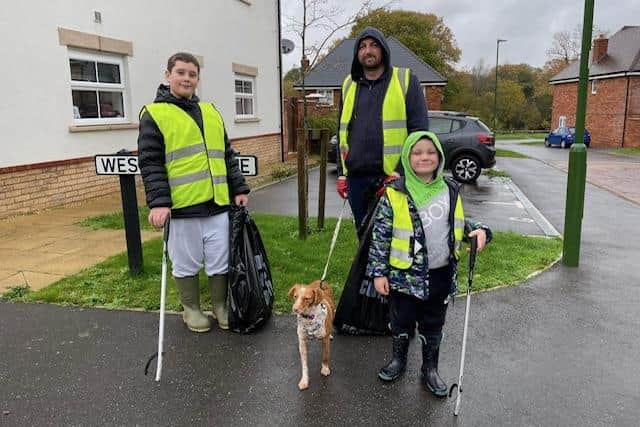 James Bravery, right, with dad Tom and brother Josh - and pet dog Jess
