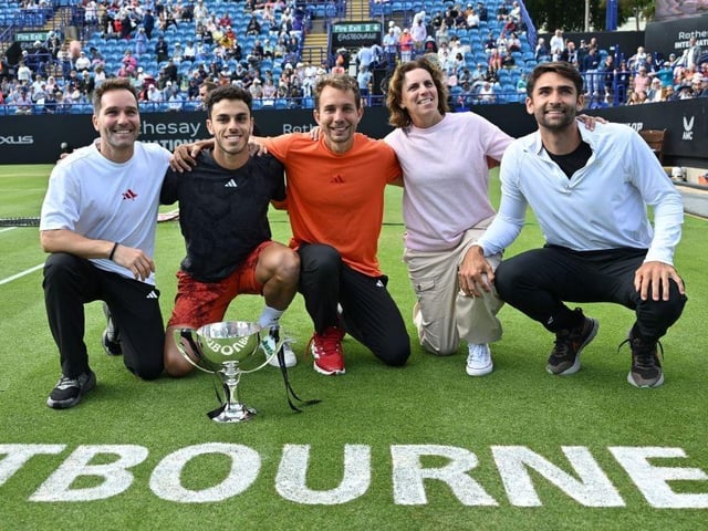 Argentina's Francisco Cerundolo (2L), his mother Maria Luz (2R) and his team, pose with the trophy after his victory over US player Tommy Paul in their men's singles final tennis match at the Rothesay Eastbourne International tennis tournament in Eastbourne, southern England, on July 1, 2023. Cerundolo won in three sets. (Photo by Glyn KIRK / AFP) (Photo by GLYN KIRK/AFP via Getty Images):Action from Saturday's finals at the Rothesay tennis international at Devonshire Park, Eastbourne