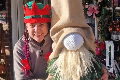 The Flower Shop owner Michelle Bly with a gonk she made