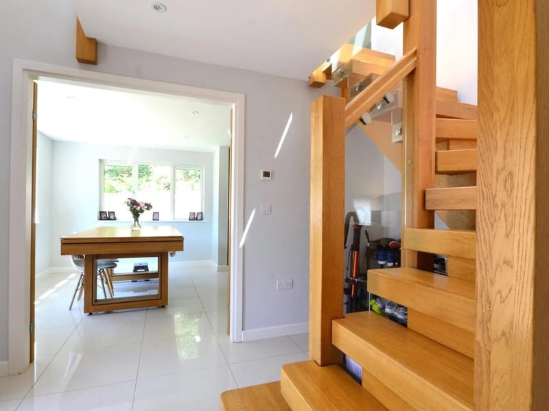 The entrance hall has a galleried landing
