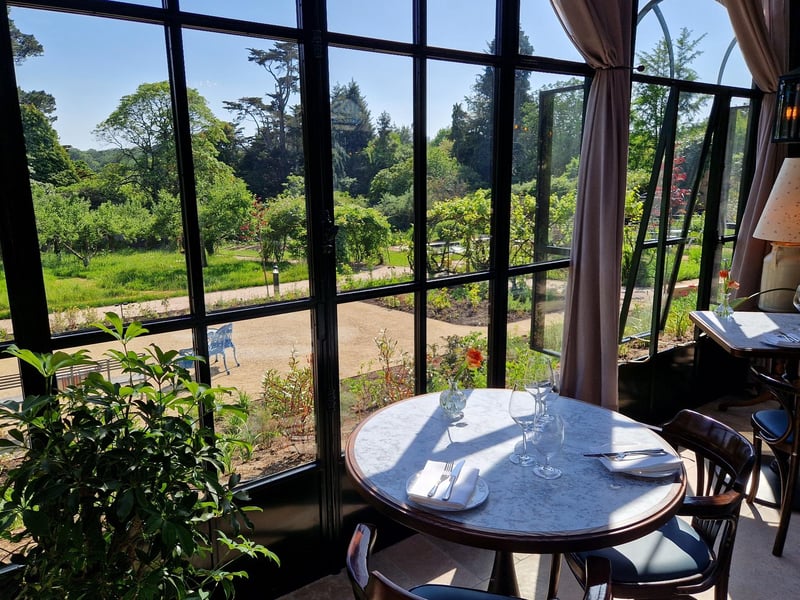 The glasshouse overlooks the garden