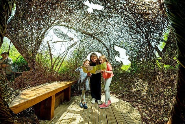 Laura Voyce with daughters Amelie and Romy image life in a nest in the Reedbed Willow Sphere on the Drawn to Water Trail at Arundel Wetland Centre.