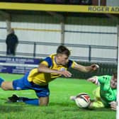 Fletcher Holman of Eastbourne Town dives for the ball with the Egham goalkeeper in Town's FA Vase loss | Picture: Josh Claxton