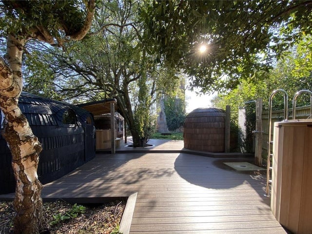The garden space includes composite decking, a rainfall shower, hot tub and cold-water therapy pool