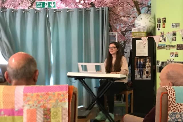 ​Emily Sapsed performing at the Bradbury Wellbeing Centre at Guild Care's Haviland House as part of a community outreach programme